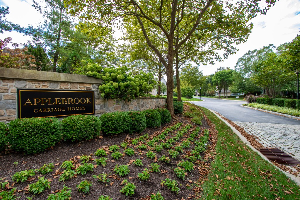 Entryway sign for Applebrook Carriage Homes in Malvern, PA, marking the community where roof replacement project was completed