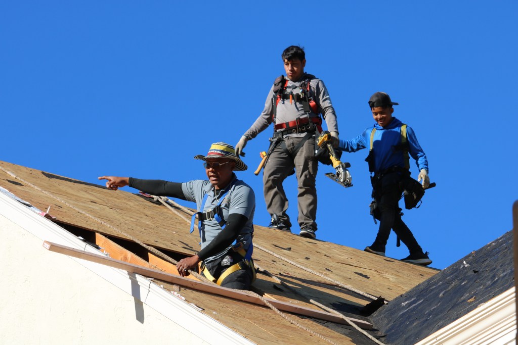 Lemus Construction crew preparing roofing materials at Applebrook Carriage Homes, Malvern PA