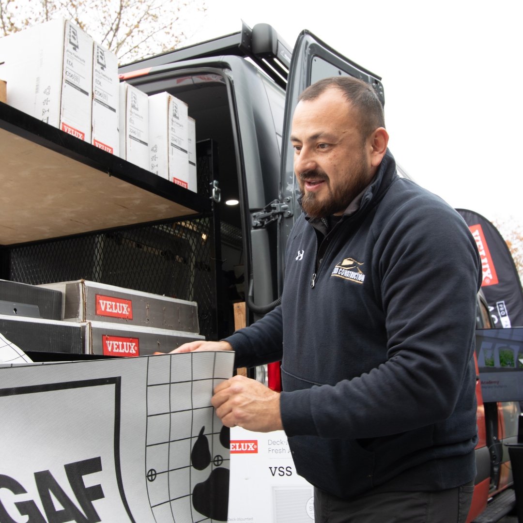 Lemus Construction team inspecting commercial roofing with certified warranty oversight