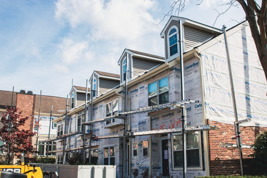 Installing CertainTeed siding panels on Cheswold Village units, Chesterbrook, PA
