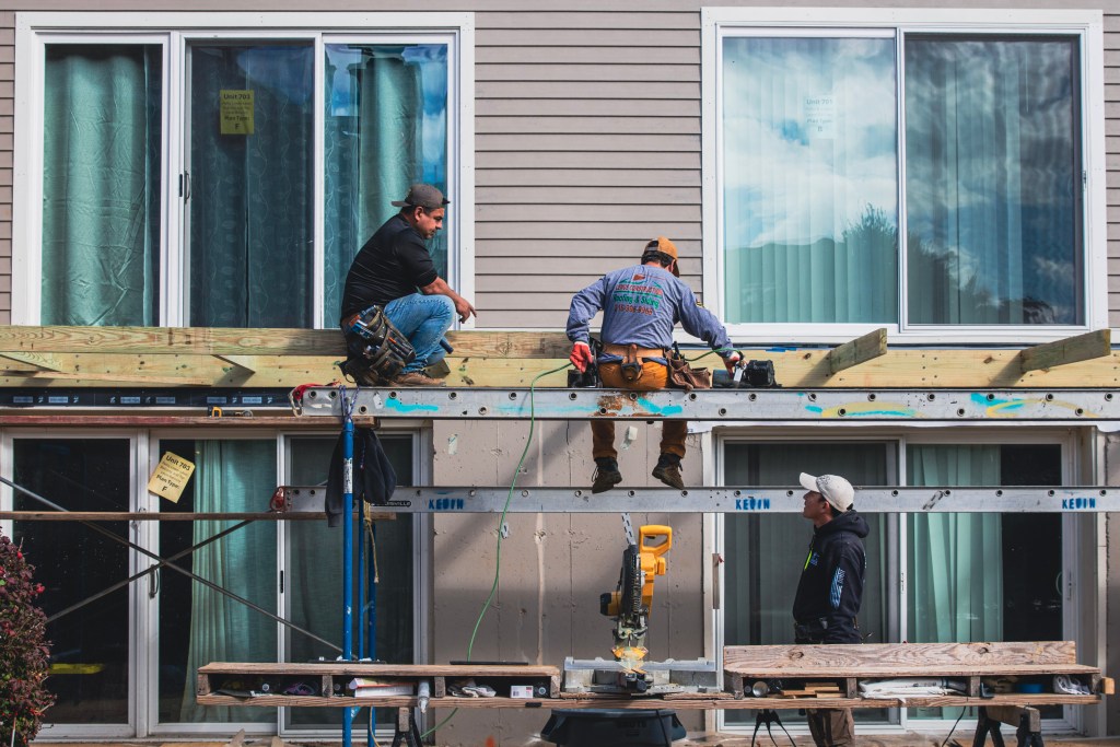 Team installing a wooden deck frame at Cheswold Village, Chesterbrook, PA