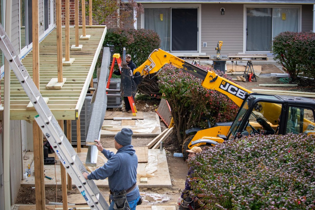 Lemus Construction crew assembling a British steel deck at Cheswold Village, Chesterbrook, PA