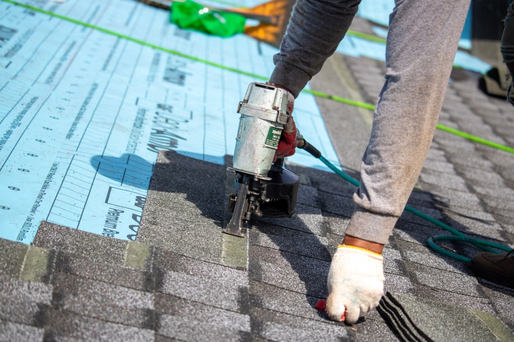 Lemus Construction team installing GAF shingles on rooftop at The Villas at Packer Park, Philadelphia, PA